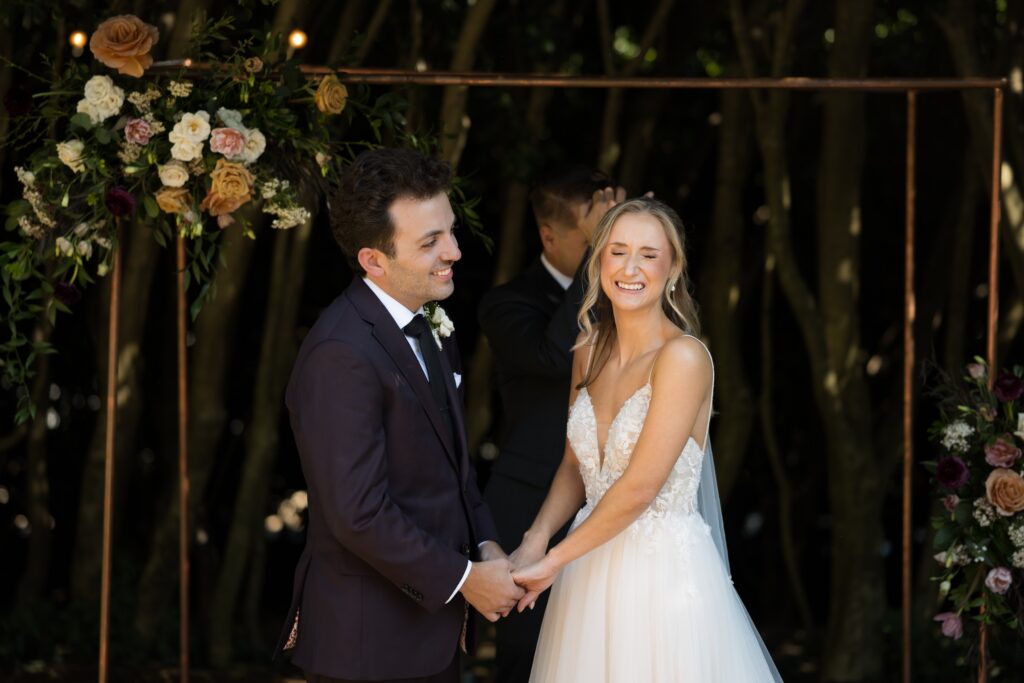 Intimate garden ceremony at McGill Rose Garden Charlotte NC photographed by Bekah Cabrejos Photography