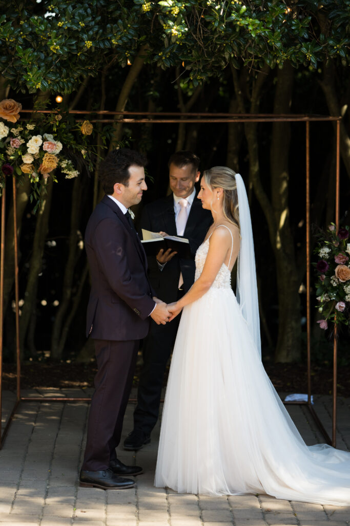 Intimate garden ceremony at McGill Rose Garden Charlotte NC photographed by Bekah Cabrejos Photography