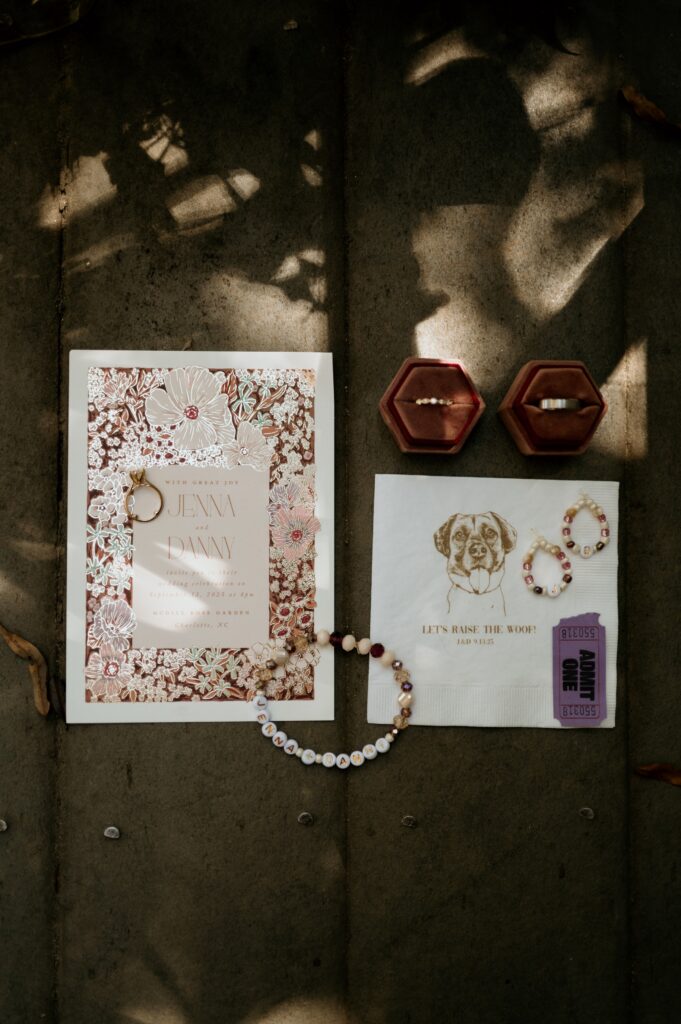 Wedding detail flat lay with friendship bracelet table settings at McGill Rose Garden Charlotte NC photographed by Bekah Cabrejos Photography
