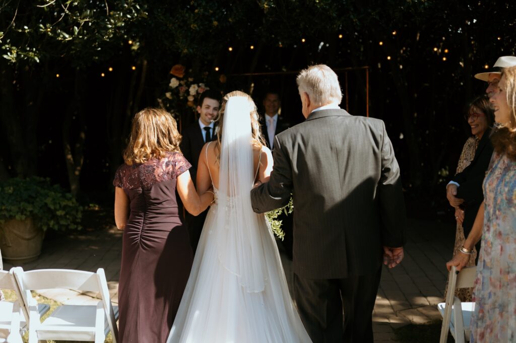 Intimate garden ceremony at McGill Rose Garden Charlotte NC photographed by Bekah Cabrejos Photography