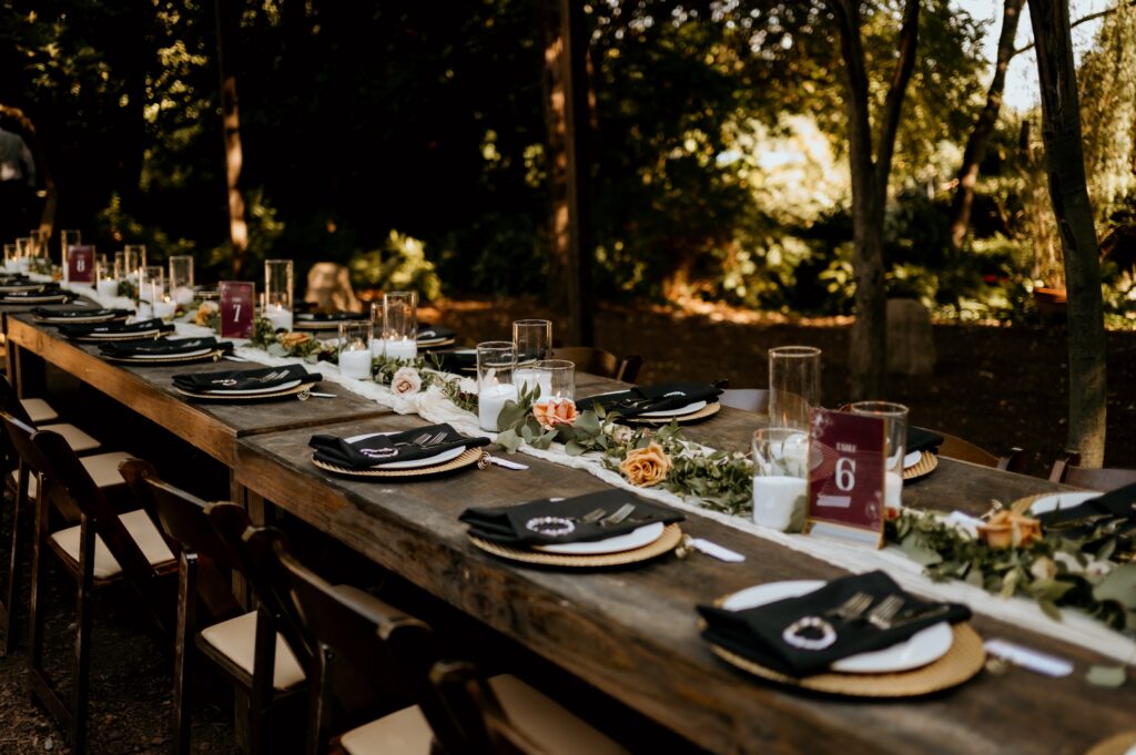Wedding detail flat lay with friendship bracelet table settings at McGill Rose Garden Charlotte NC photographed by Bekah Cabrejos Photography
