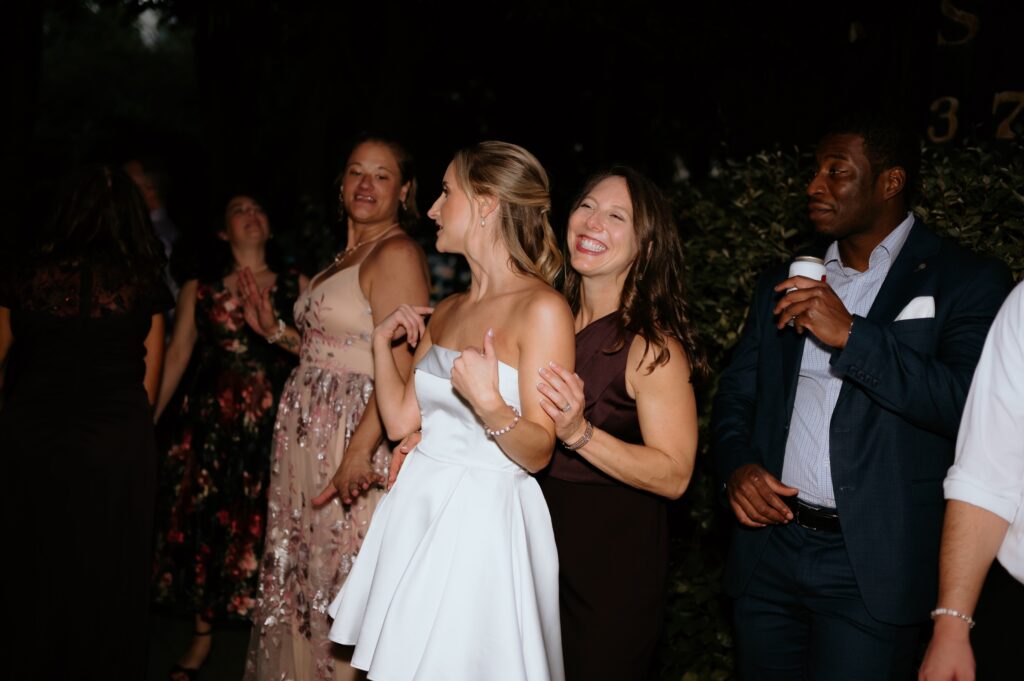 Intimate garden reception and hora at McGill Rose Garden Charlotte NC photographed by Bekah Cabrejos Photography