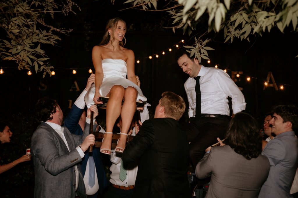 Intimate garden reception and hora at McGill Rose Garden Charlotte NC photographed by Bekah Cabrejos Photography